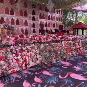 Elegant Floral Wedding Stage Decoration with Pink and Red Accents photo